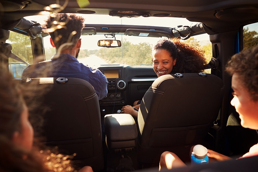 Boardwalk Resort Vacations family traveling together during a long car journey.